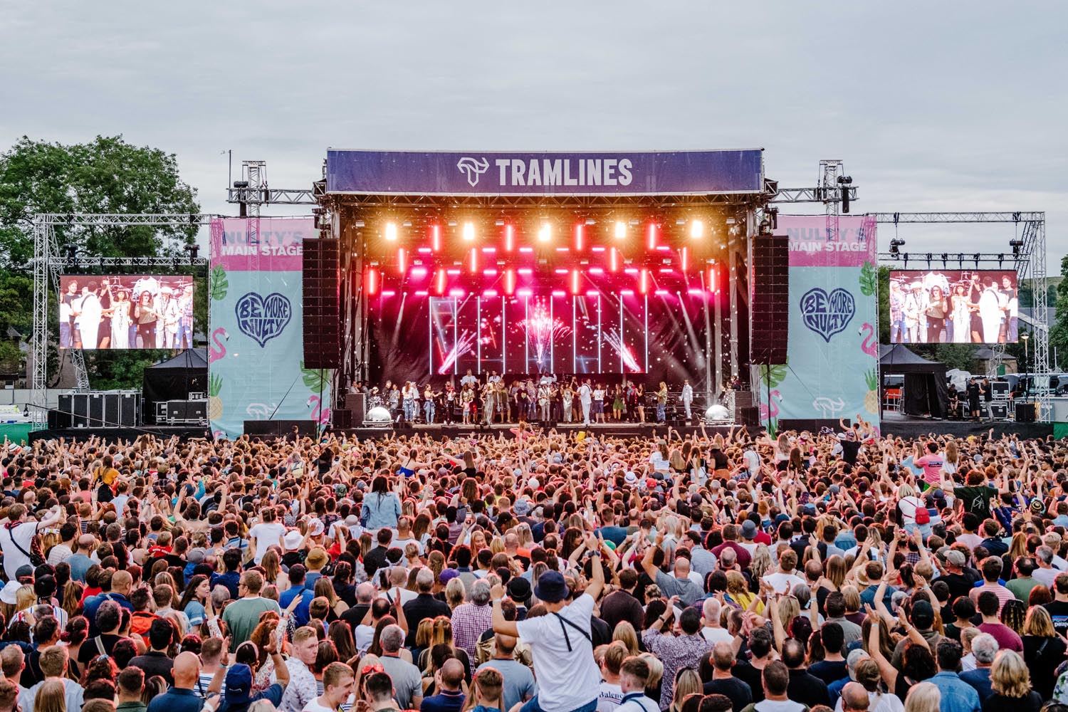 Tramlines Festival in 2019, showing the stage in the distance with a huge crowd enjoying the show.