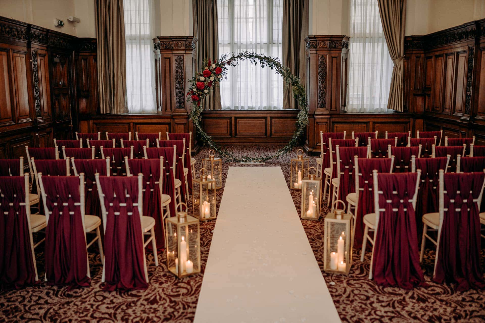 Conference room set up for a wedding with rows of chairs.
