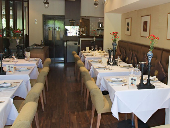 Rows of tables beautifully laid out at the All Siam Thai Restaurant.
