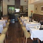 Rows of tables beautifully laid out at the All Siam Thai Restaurant.