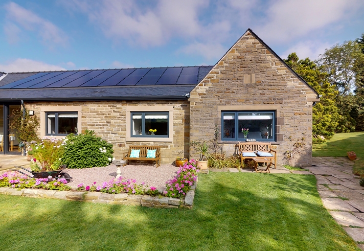 Exterior view of Finkle Green Bed and Breakfast with entrance and surrounding greenery