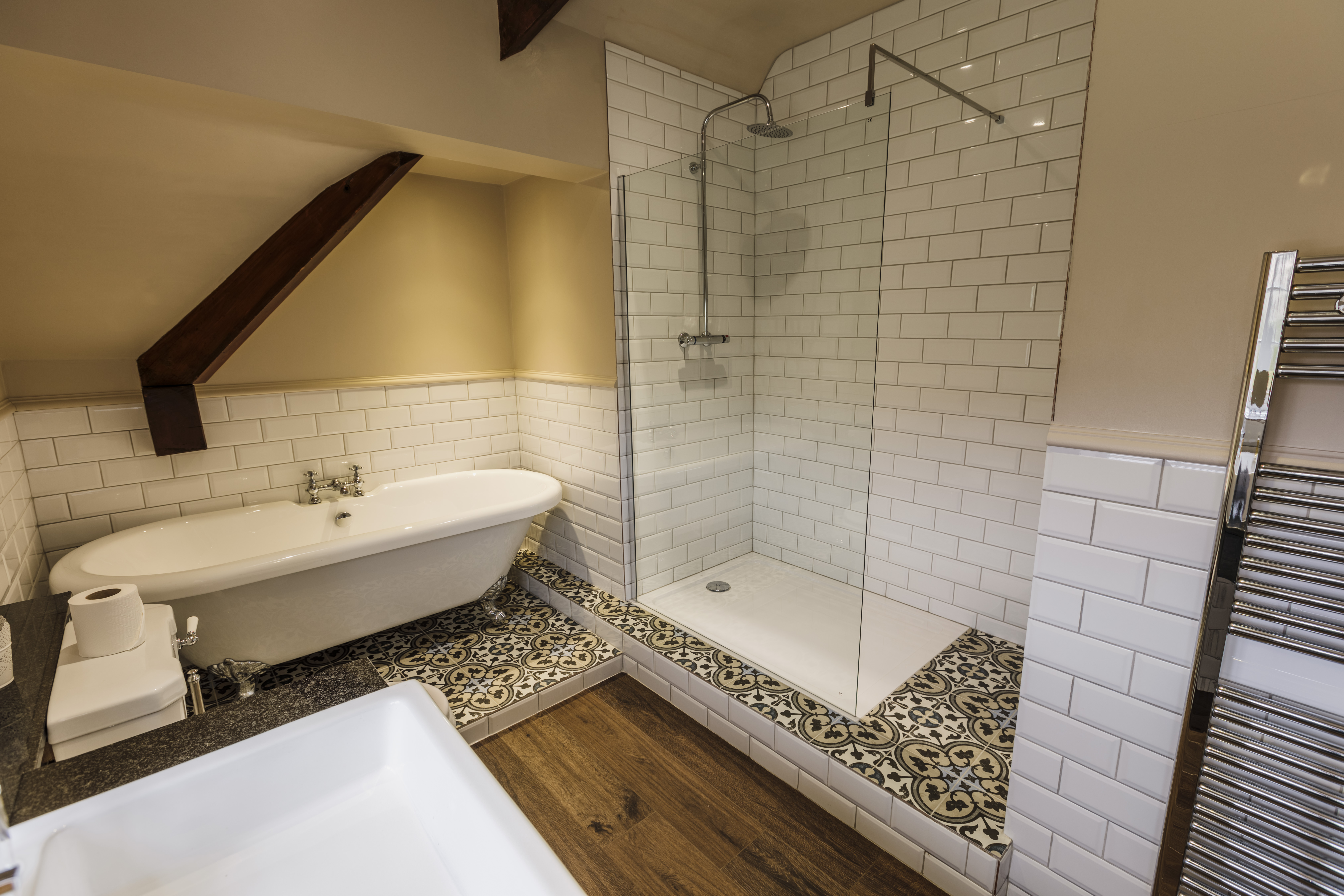 Modern bathroom in a Losehill Hall Hotel guest room with sleek fixtures and a clean design with bath and walk-in shower.