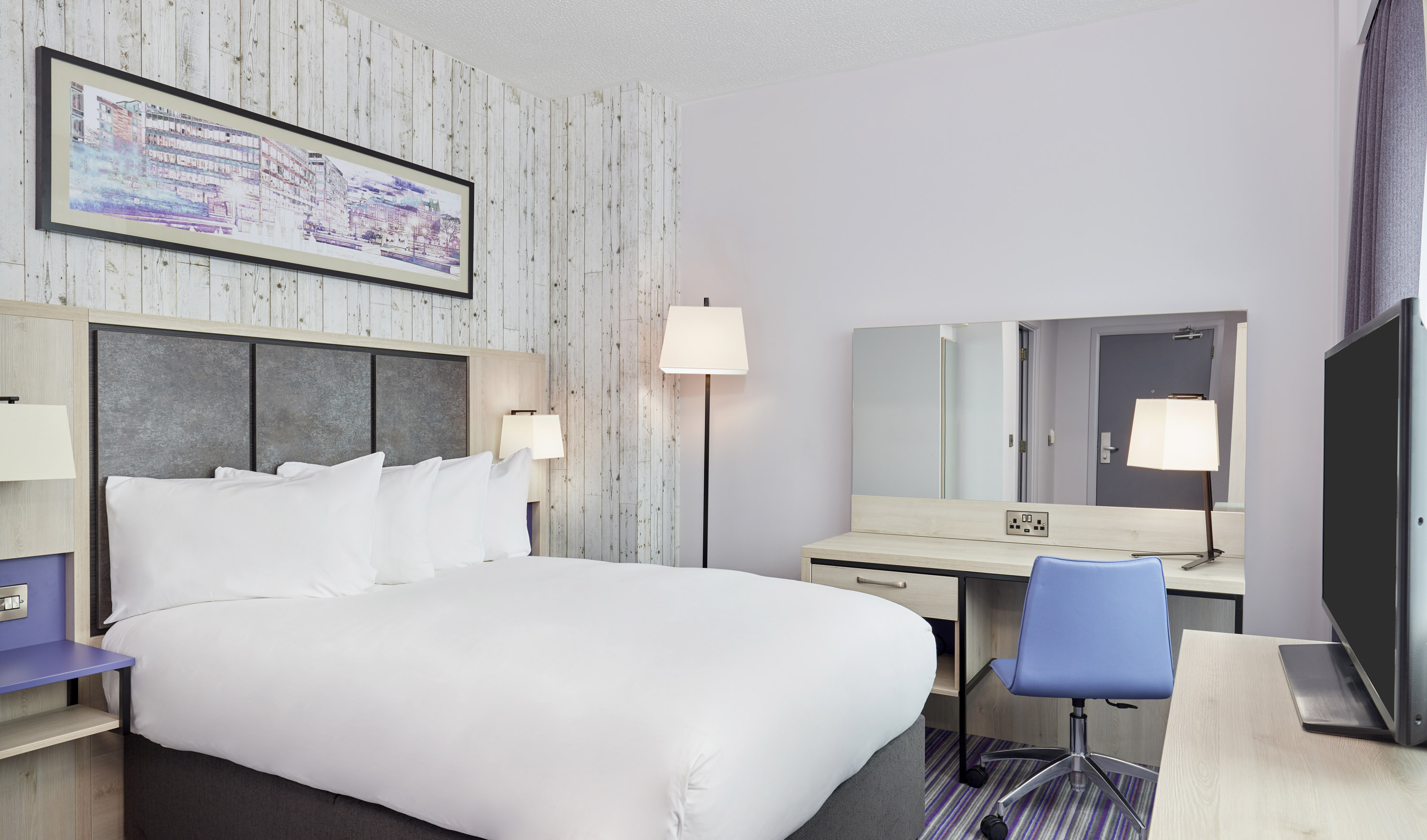 Bedroom featuring one double bed with modern furnishings.