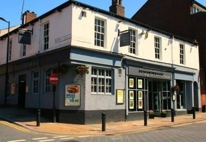 Exterior of The Frog and Parrot pub.