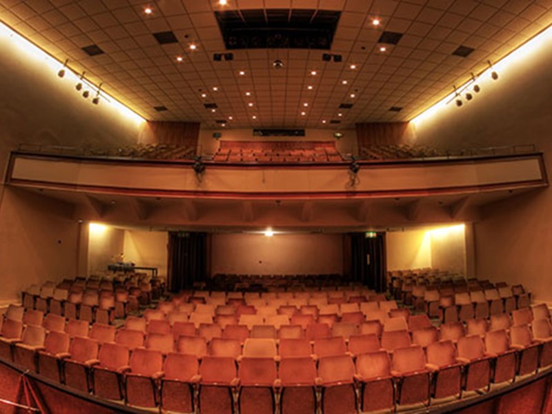 A view of the Montgomery theatre, from the back, looking across the seating, towards the stage.