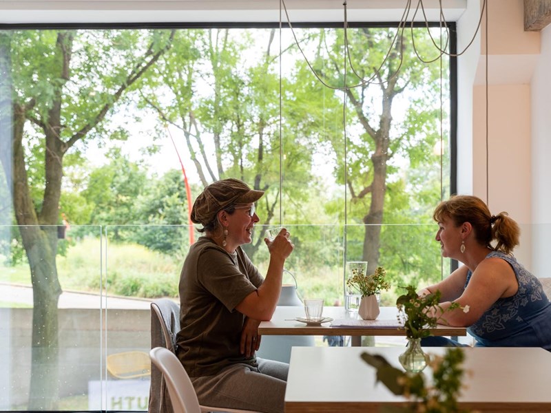 Two people sat at a table in the window at South Street Kitchen.