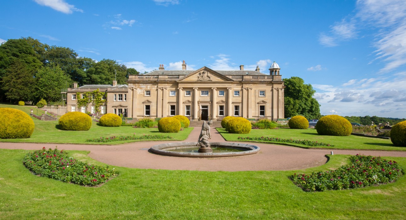 Front exterior of Wortley Hall stately home, showcasing its historic architecture and landscaped grounds.