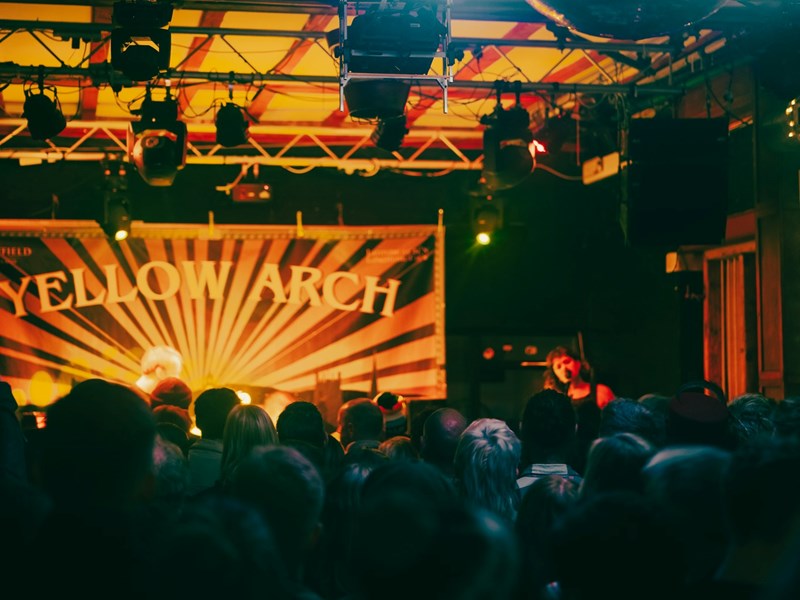 A crowd enjoys a live band at Yellow Arch Studios in Sheffield.