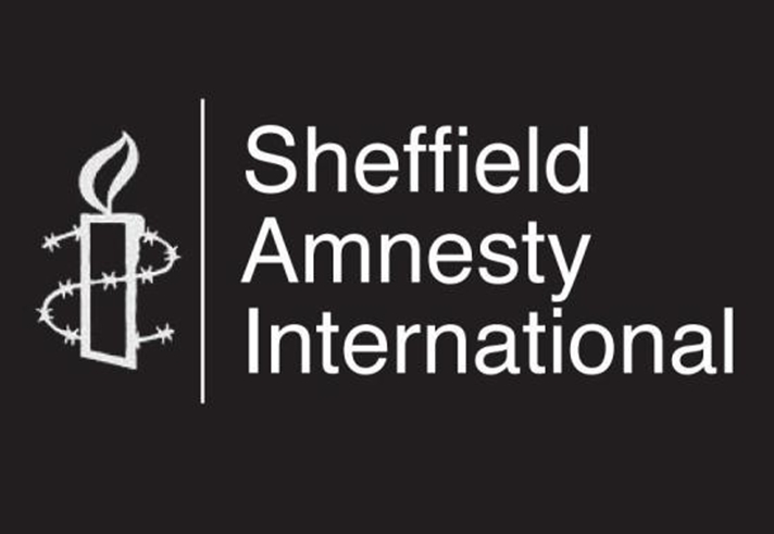 The Sheffield Amnesty International logo which is a line drawing of a candle wrapped in barbed wire and the words Sheffield Amnesty International, all in white on a black background.