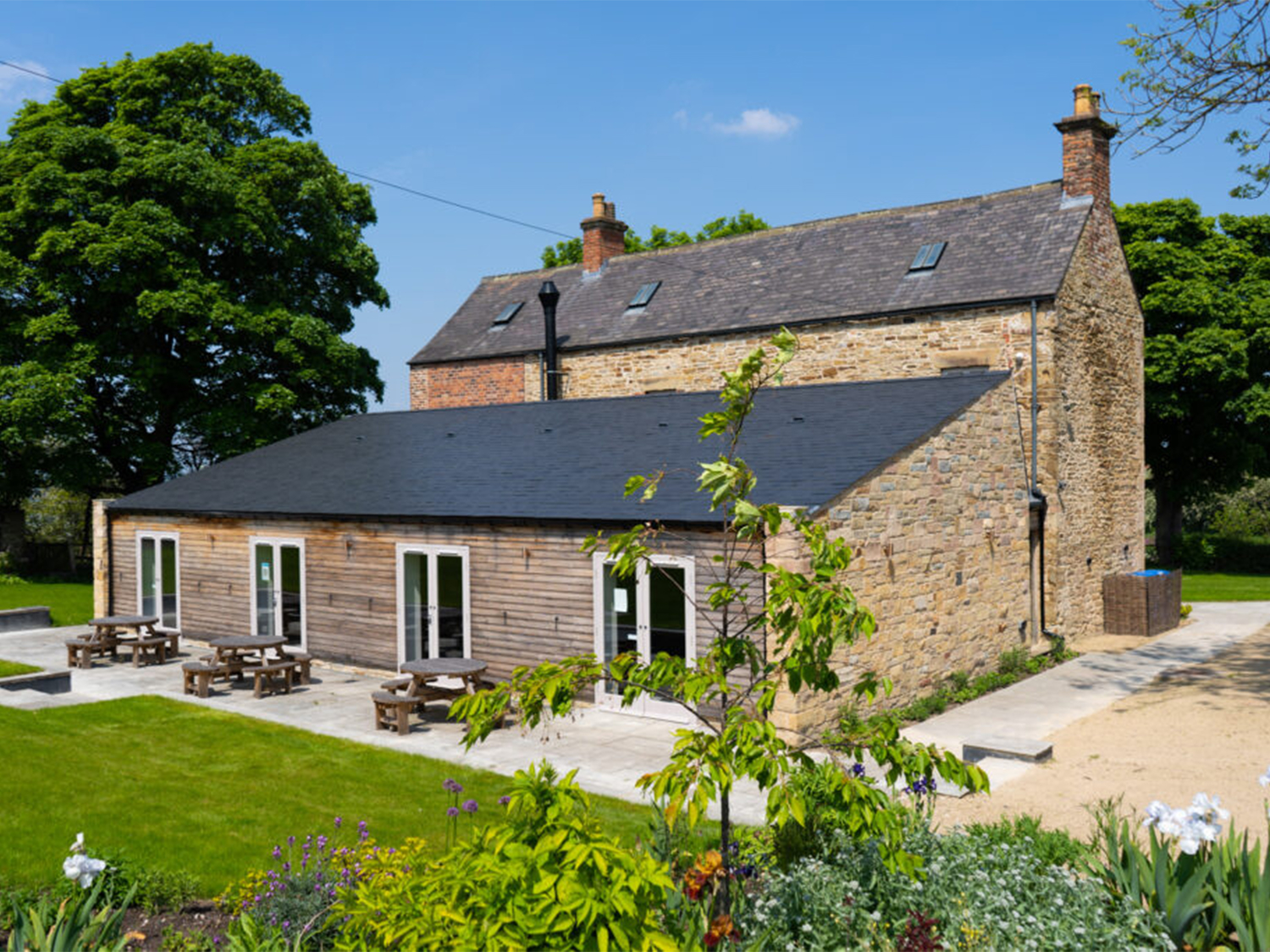 An exterior photo of the back of Manor Oaks House.