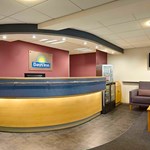 Reception area with front desk, seating, and welcoming décor.