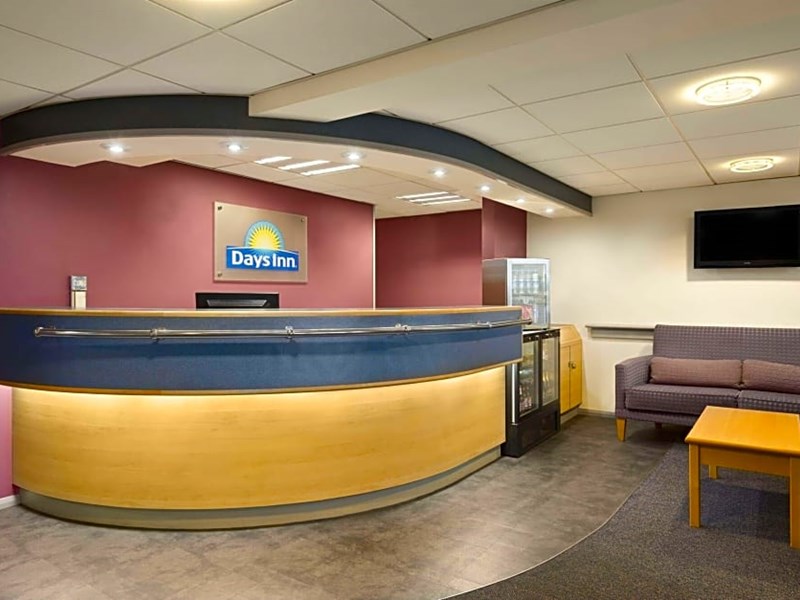 Reception area with front desk, seating, and welcoming décor.