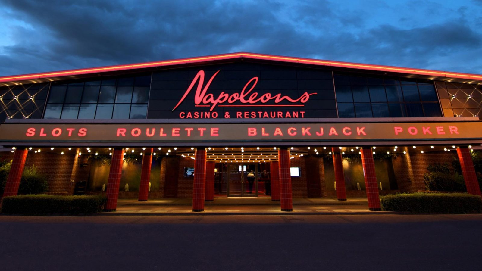 The exterior of Napoleons Casino & Restaurant at night.