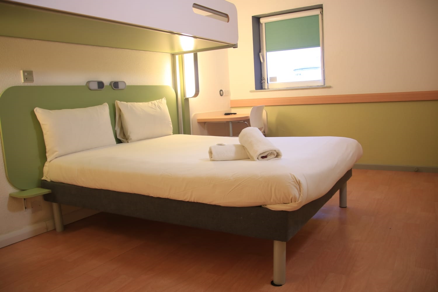 Bedroom with a double bed and a bunk bed above.