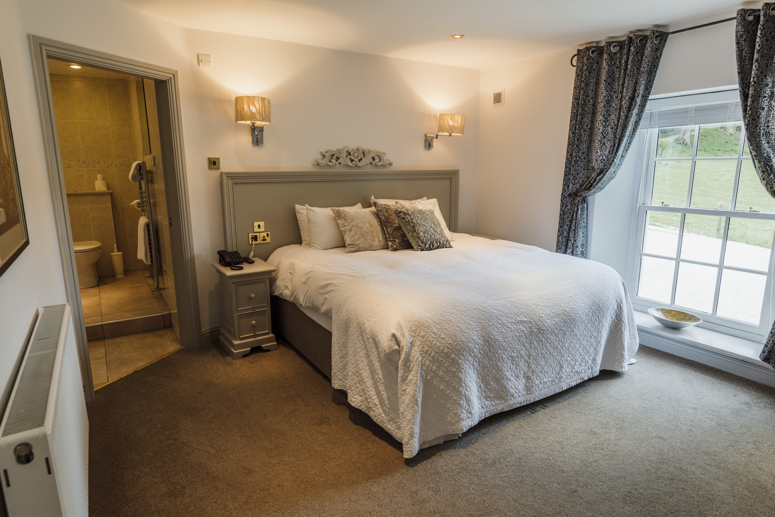 Bright and cosy guest room featuring a double bed at Losehill Hall Hotel.