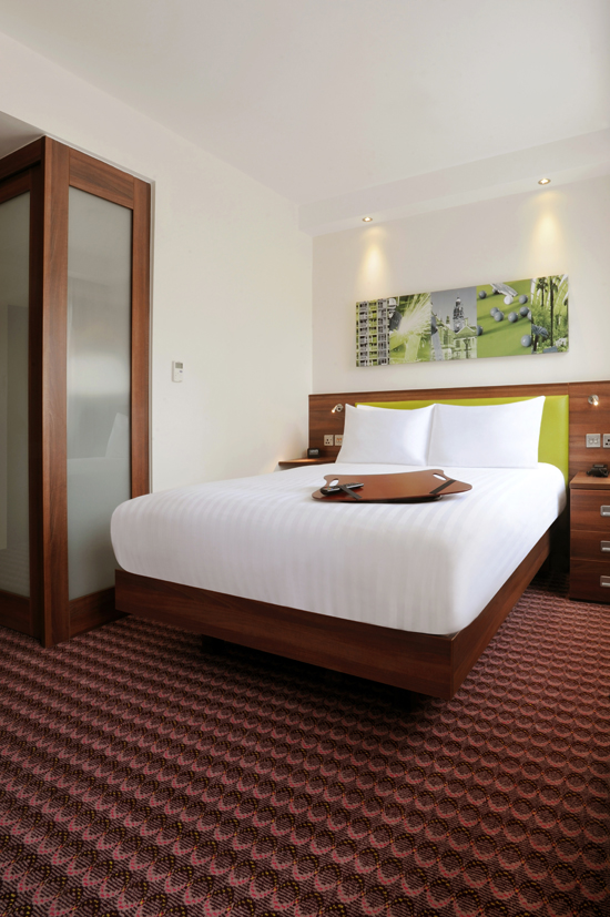 Modern double bed setup in a guest room at Hampton by Hilton Sheffield.
