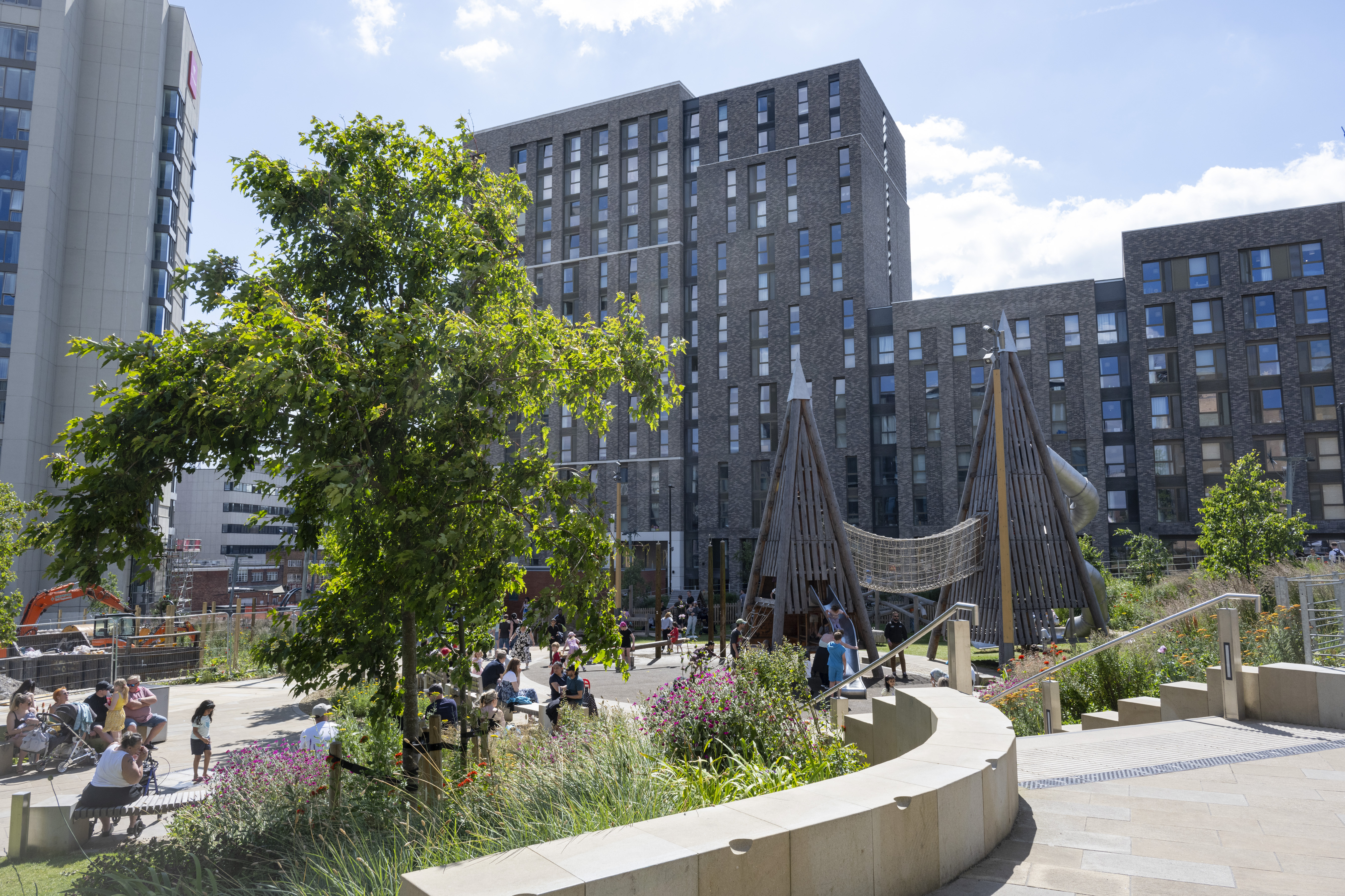 Pound's Park full of people playing and having fun on a sunny day.