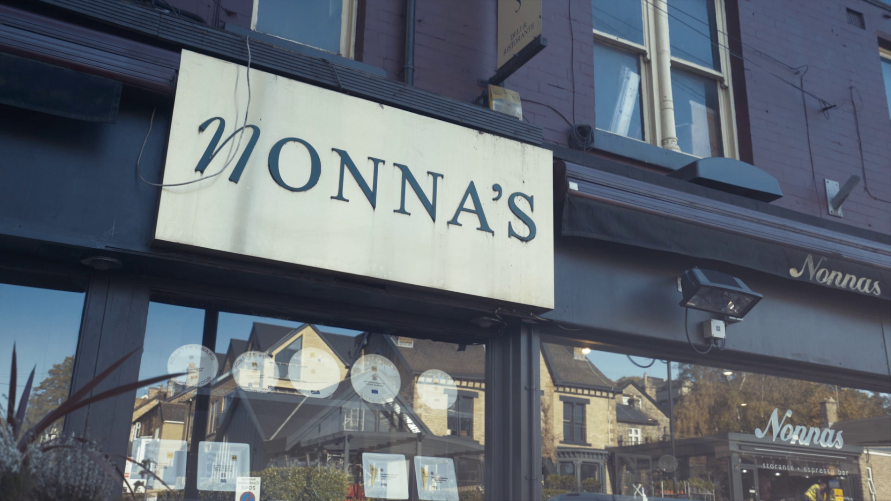 The sign on the exterior of Nonnas Restaurant.