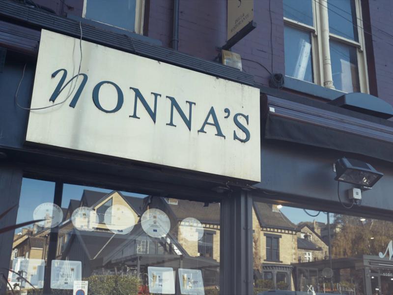 The sign on the exterior of Nonnas Restaurant.