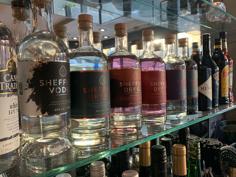 A shelf full of bottles of spirits at Turnip & Thyme.