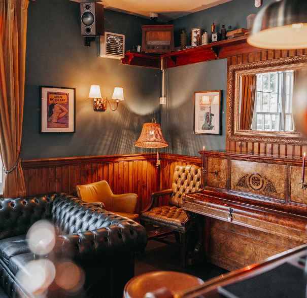 The interior of The Washington, with lots of seating and leather sofas.
