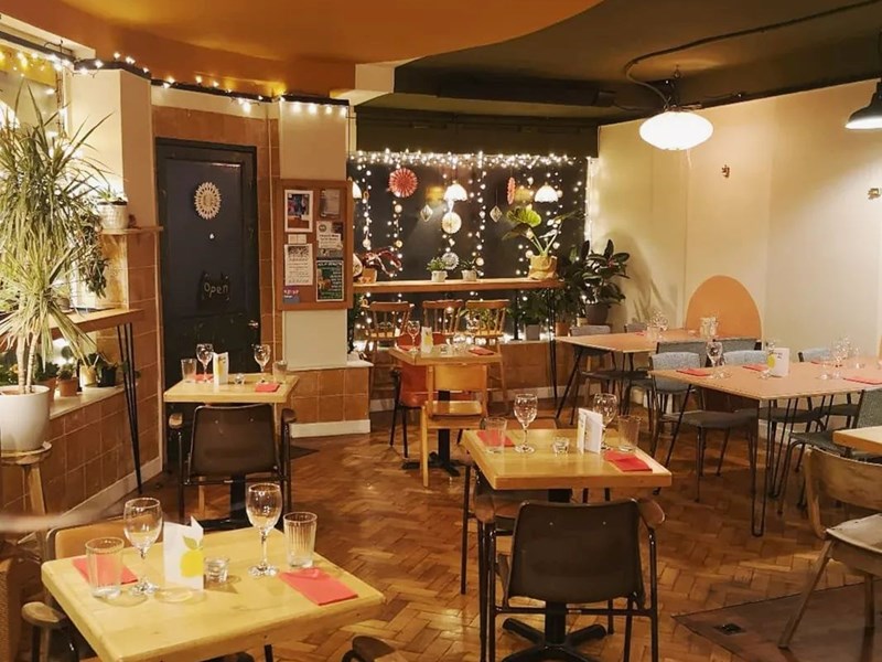 Tables set out at Kopi & Chai.