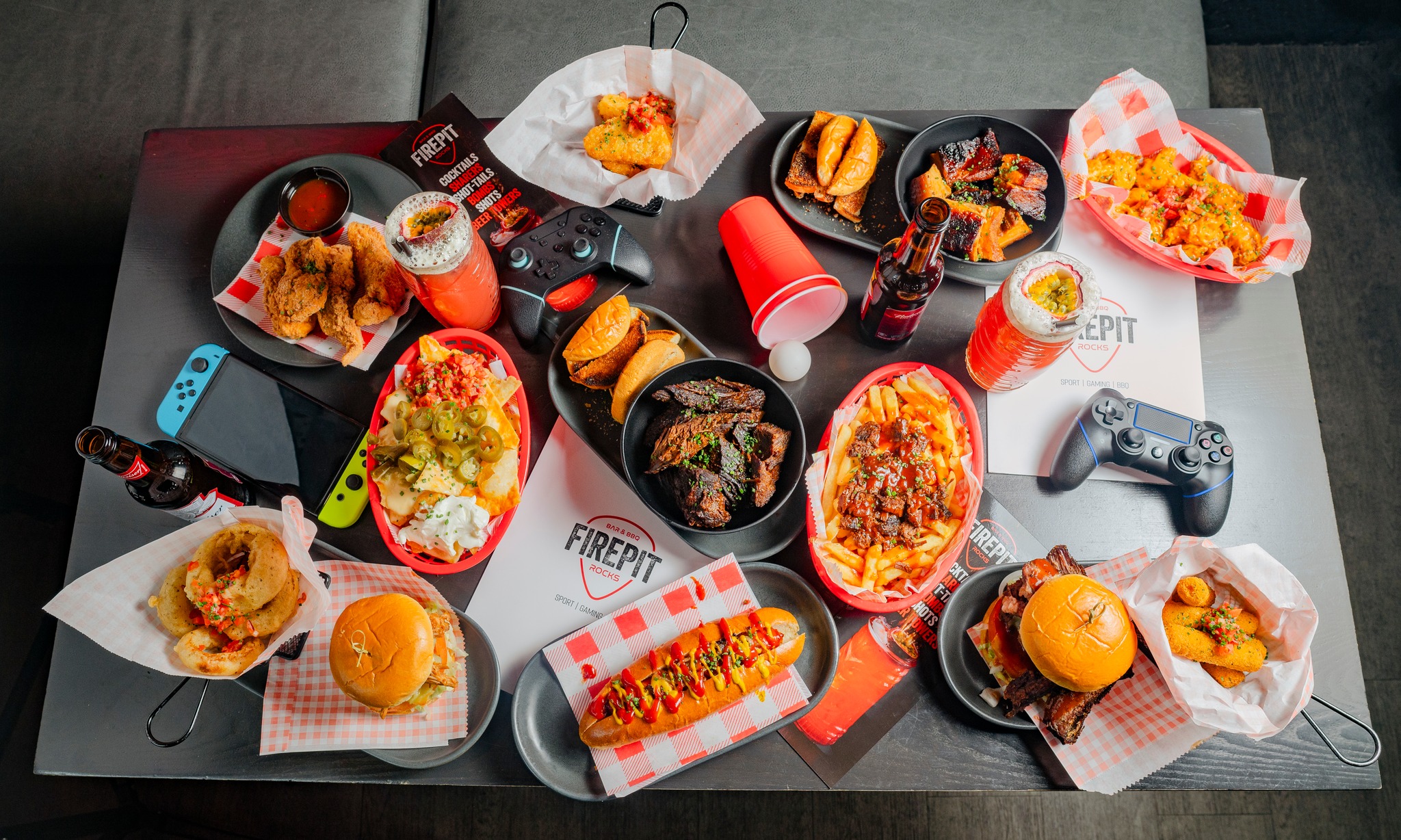 A table full of American style food at FirePit Rocks Bar and BBQ.