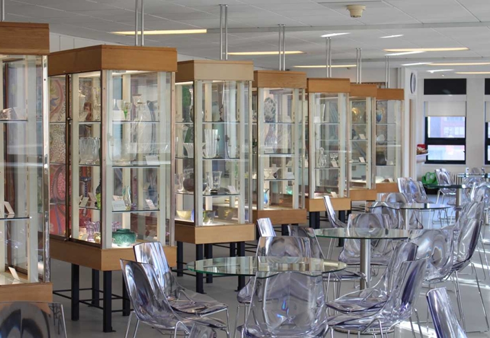Rows of display cabinets at the Turner Museum Of Glass.