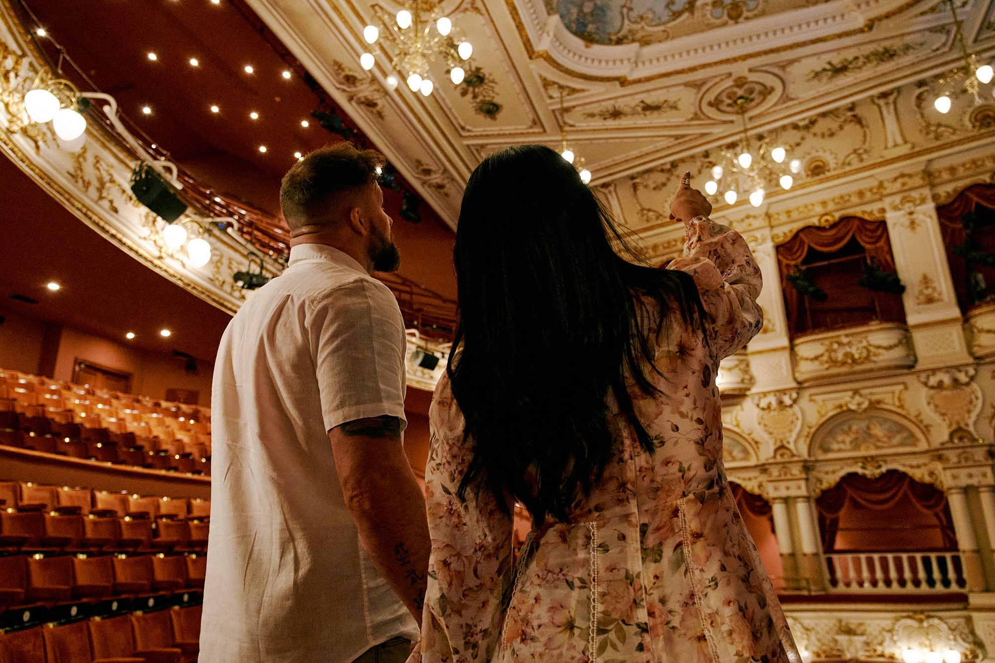 Couple looking up at the interior of the ornate Lyceum Theatre, Sheffield 