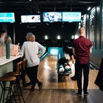 People bowling at Clubhouse.