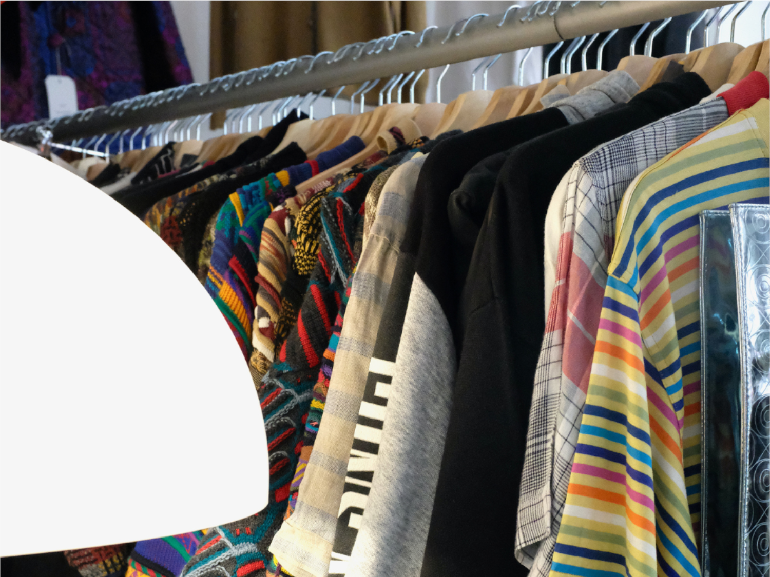 A rail of clothes for sale at Good Good Vintage.