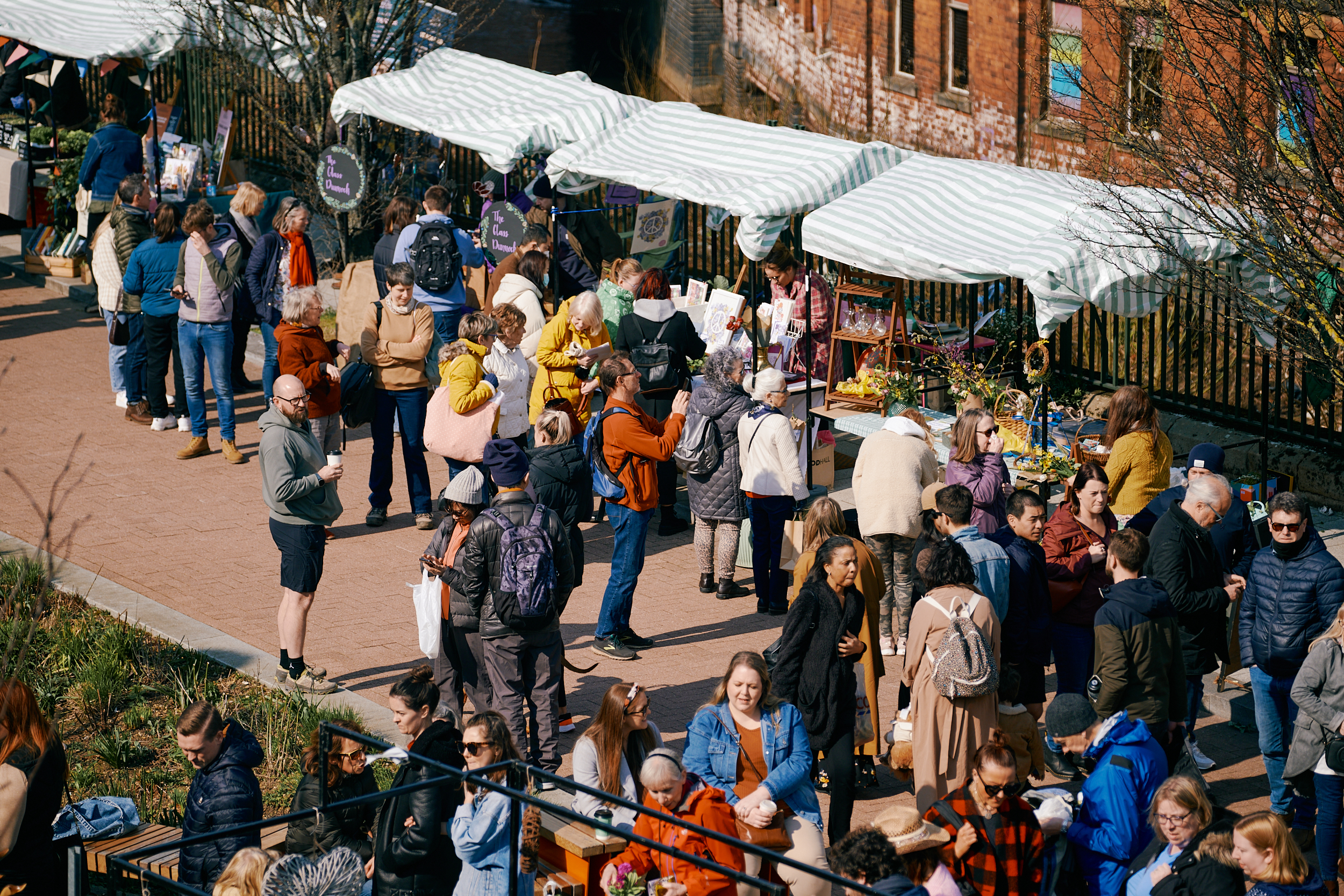 Crowds of people are looking at various stalls at Pollen Market in Sheffield.