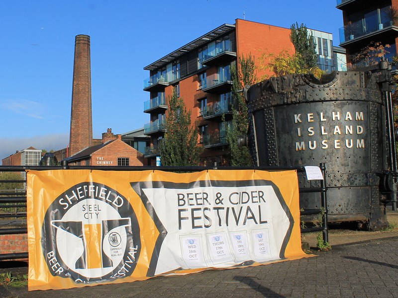 A big Steel City Beer And Cider Festival banner at the entrance to the Kelham Island Museum.