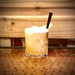 A cocktails sat on a table.