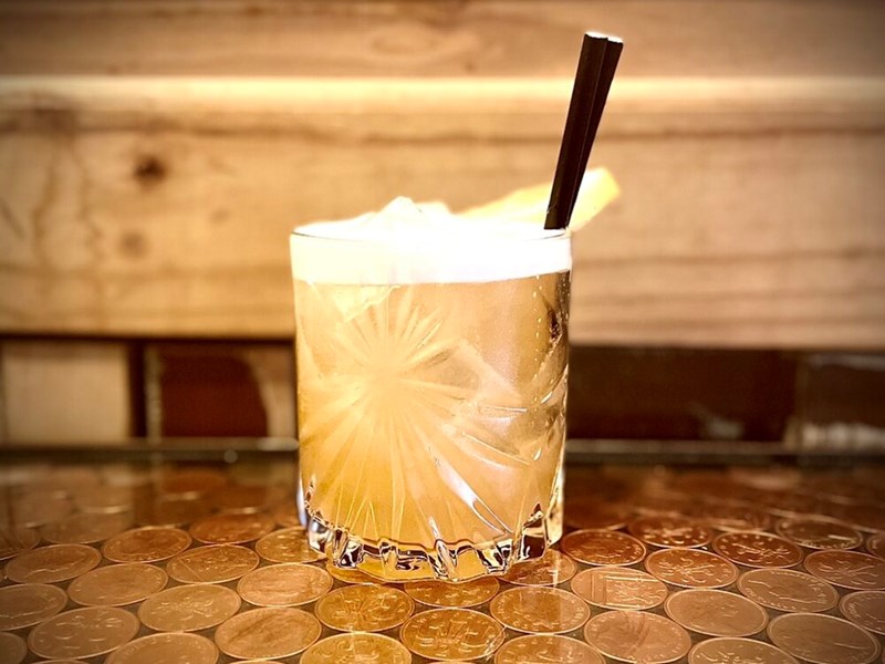 A cocktails sat on a table.