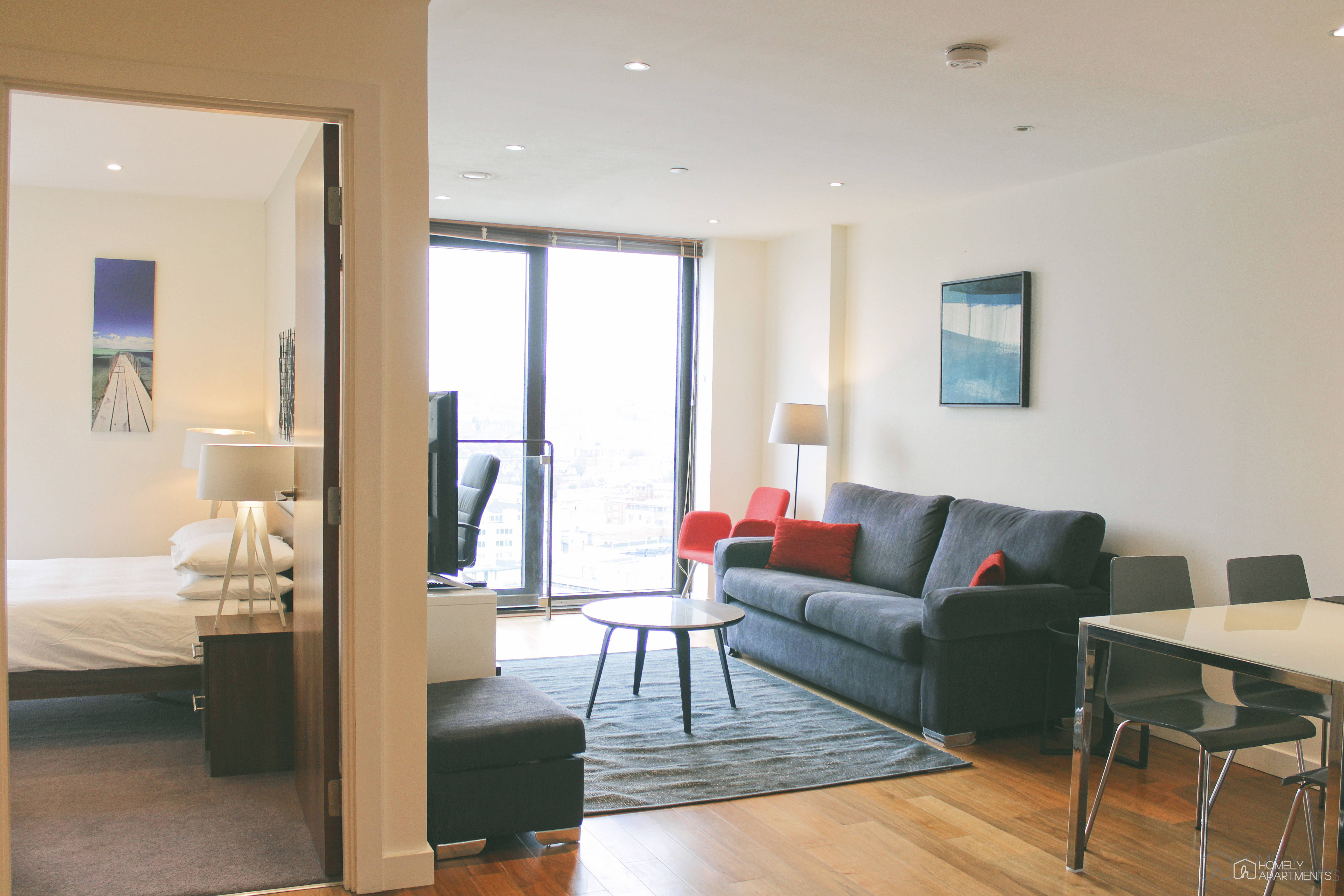 Spacious living area at Homely Serviced Apartments – St. Paul’s featuring comfortable seating and stylish furnishings.