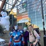 Performers dressed as characters from films, standing outside the Sheffield Winter Garden.