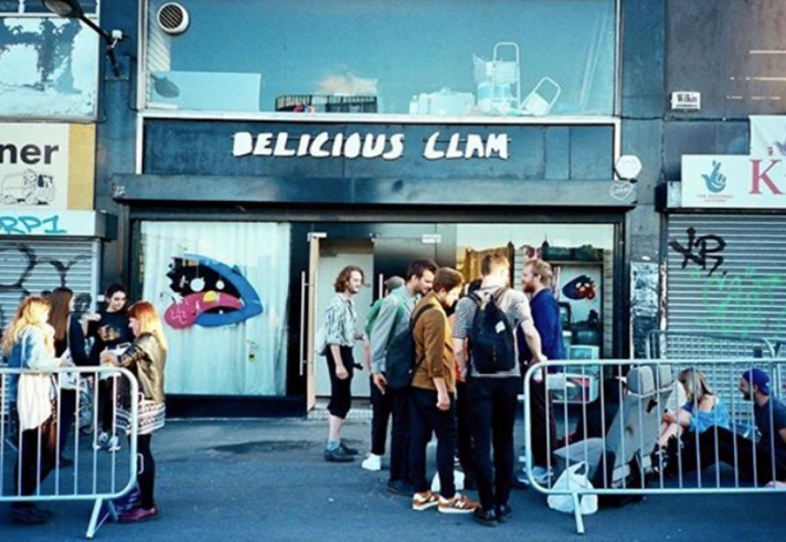 People waiting outside Delicious Clam before a gig.
