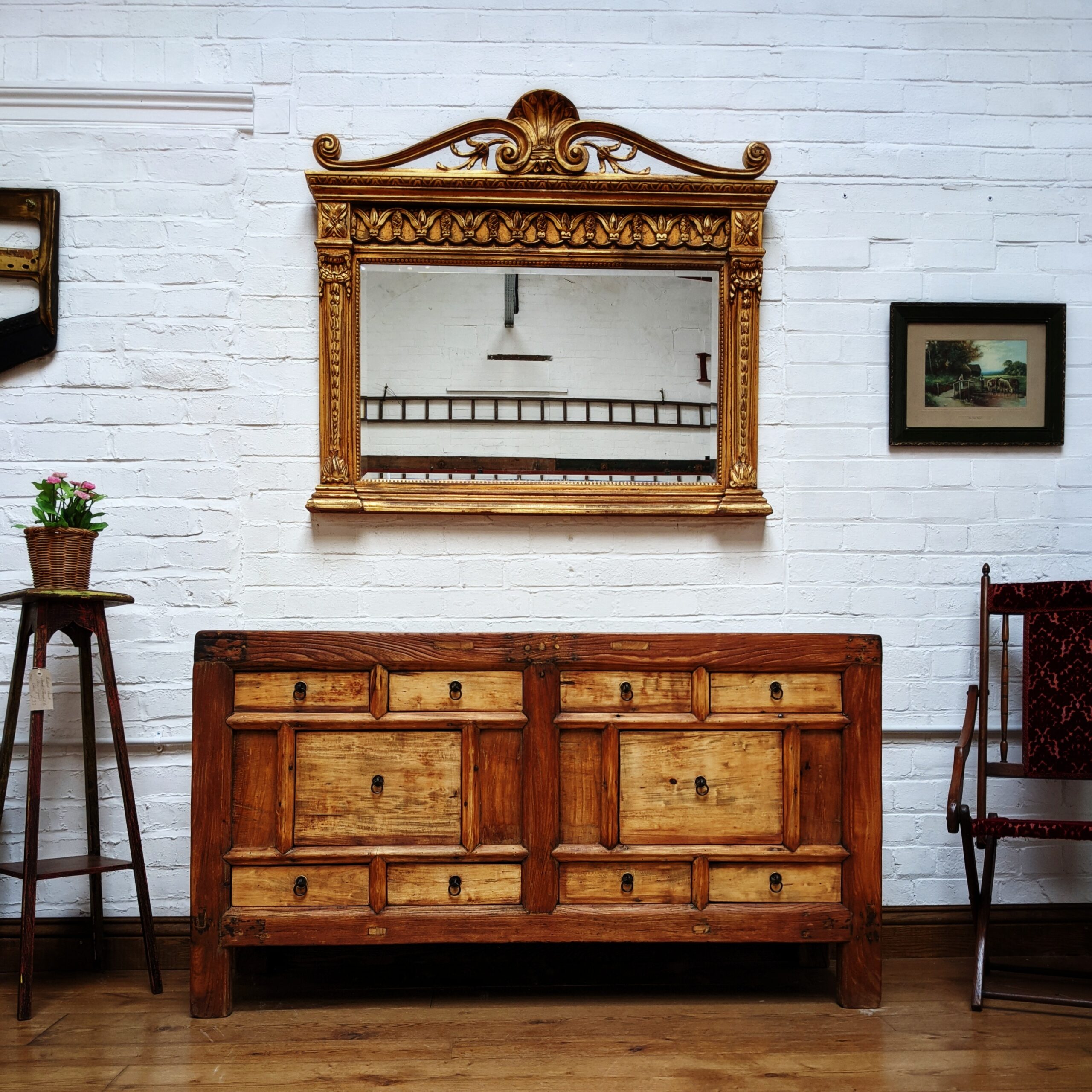 A large sideboard and  large wall mirror on display at The WareHouse.