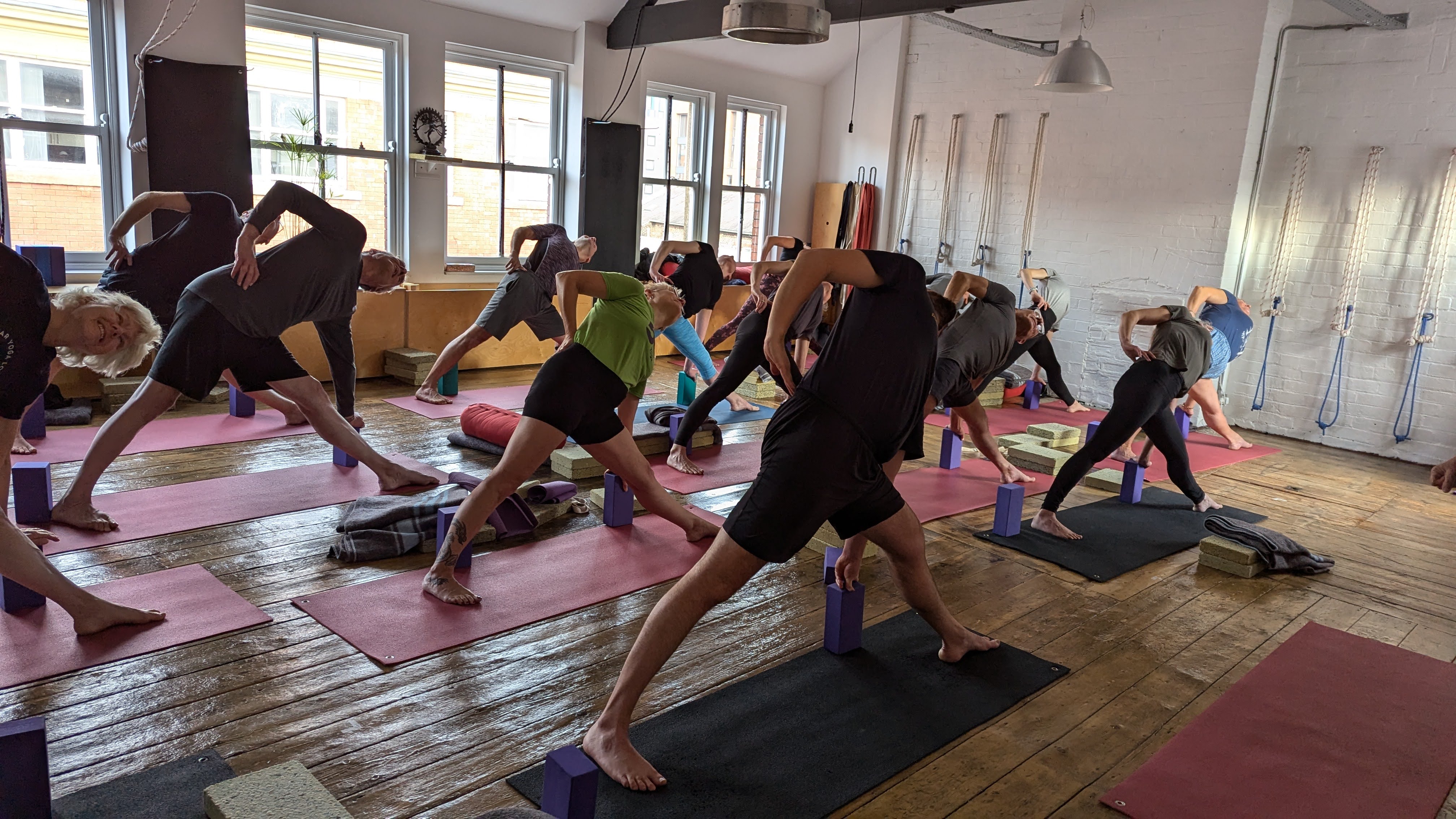 A yoga session taking place at Zagyoga Iyengar Yoga Studio.