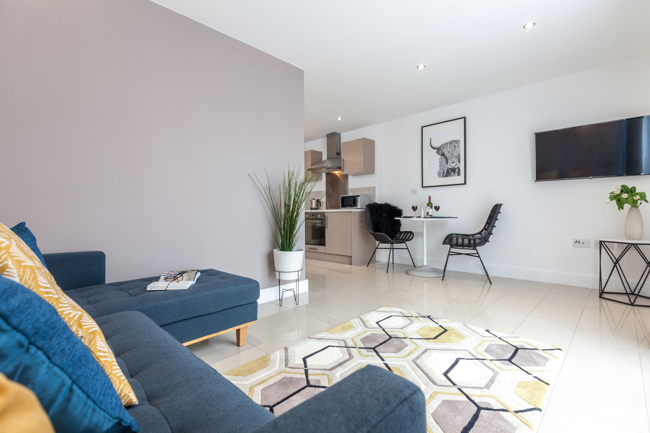 Living room at K Space @ The Point with sofa and modern décor.