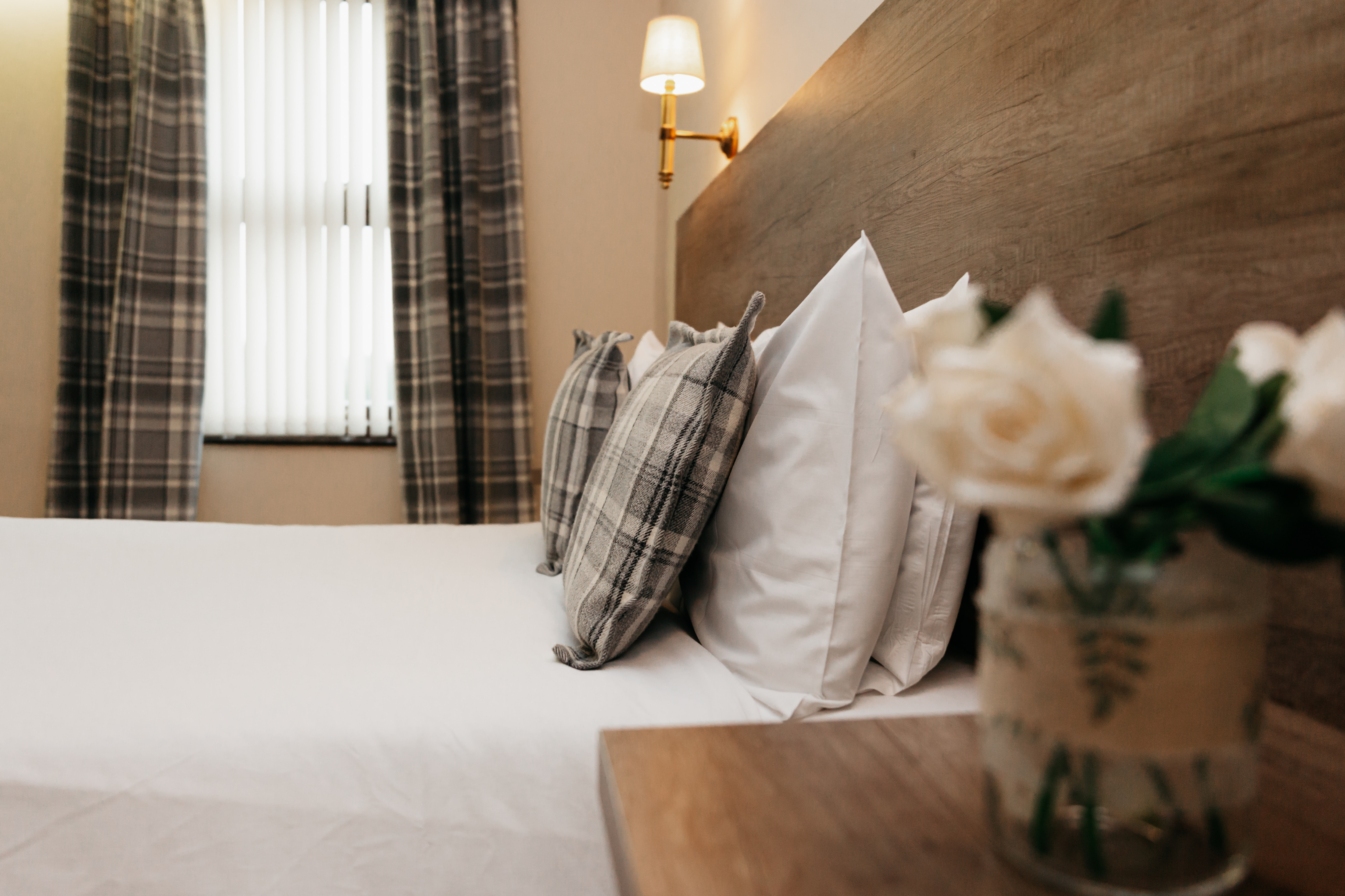 A double bed in a hotel room.