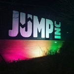 The outside wall at Jump Inc with their logo painted on the wall.