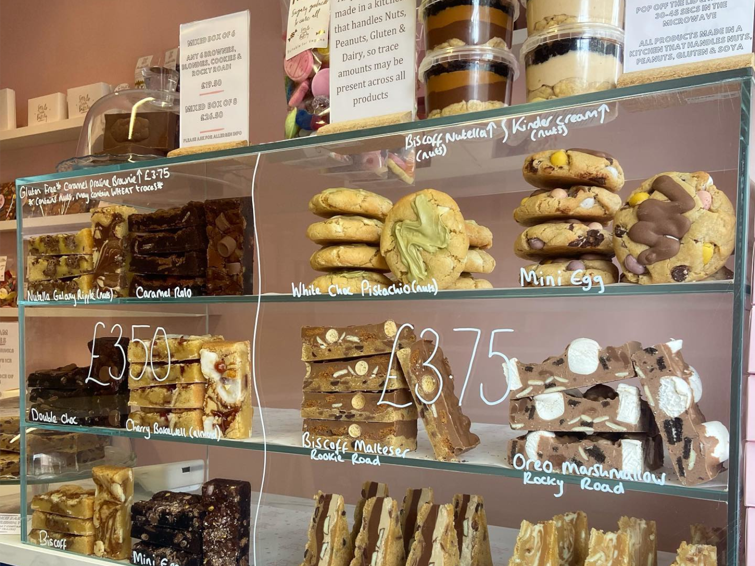 A glass cabinet full of cookies, brownies and other treats at Sorrel's Cocoa Bakery