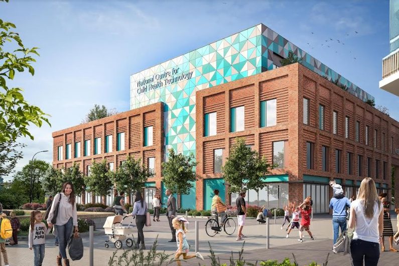A modern building with a geometric patterned upper section in turquoise and white and a lower section made of red brick. The sign on the building reads “National Centre for Child Health Technology.” The foreground shows a pedestrian area with people walking, pushing strollers, and riding bicycles. There are trees, benches, and a clear blue sky with scattered clouds, creating a bright and welcoming urban environment.