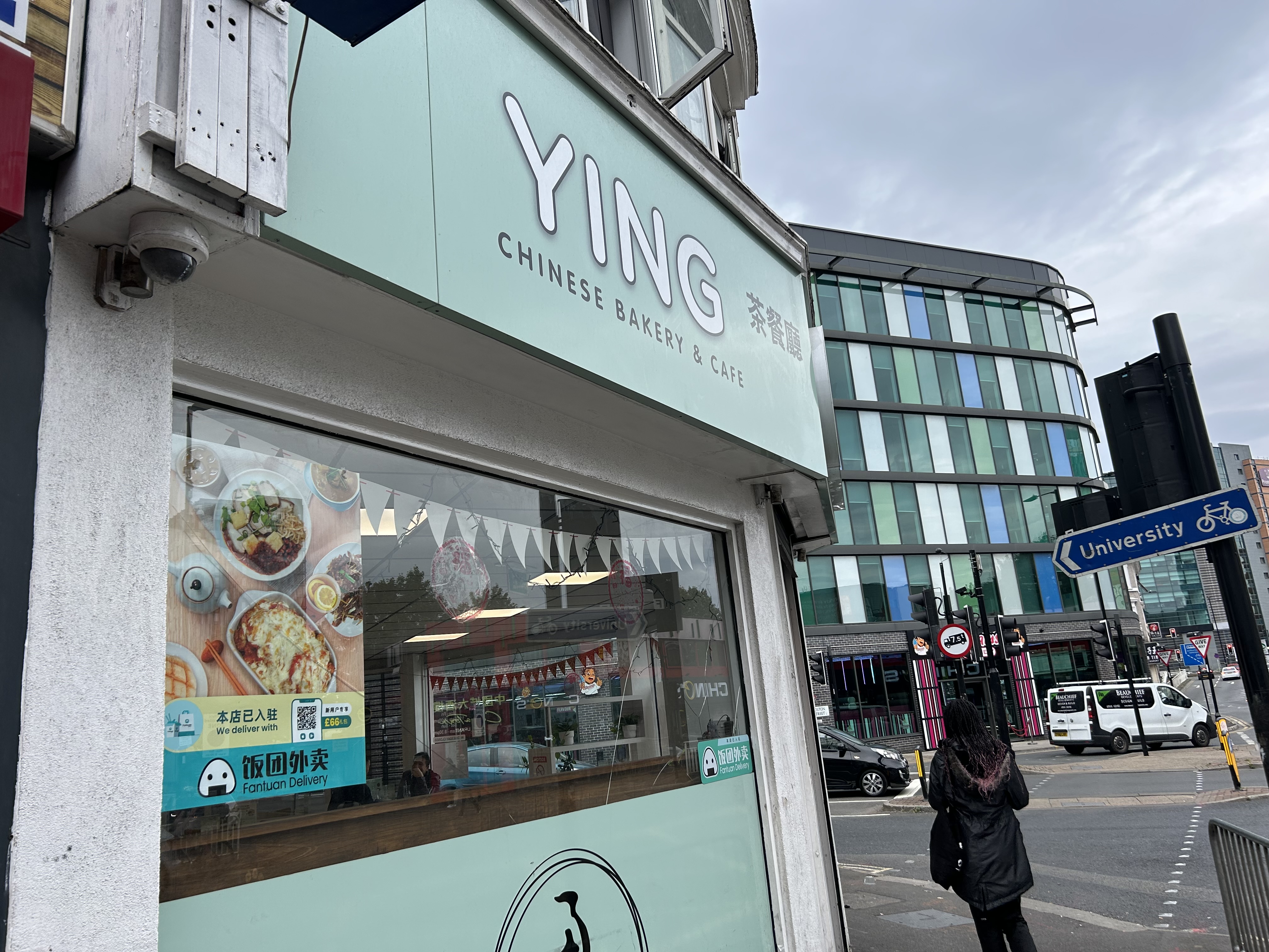 a picture outside the shop which shows the sign on top which reads Ying Chinese bakery and cafe