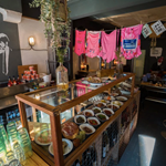 The counter at North Town, with a glass case filled with goods for sale.