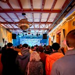 A crowd watches a band performing at Yellow Arch.