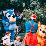 Children and adults looking at characters from Bluey.