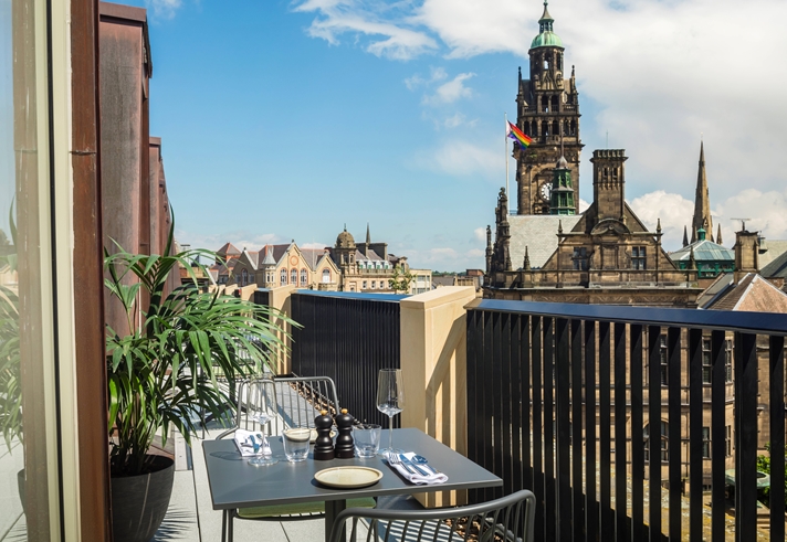 A rooftop terrace overlooking Sheffield Town Hall.